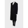 Coat with pleated back