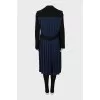 Coat with pleated back