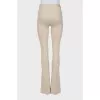 Beige flared trousers with stitched creases