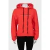 Red hoodie with slogan print
