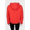 Red hoodie with slogan print