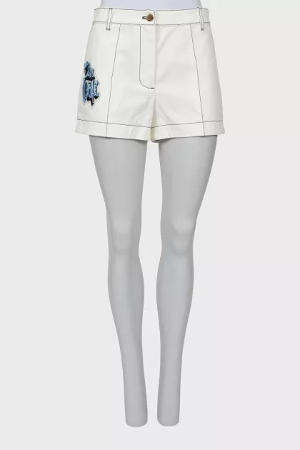 White denim shorts with patches
