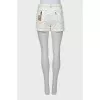 White denim shorts with patches