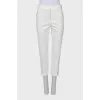 White trousers with stitched creases