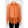 Translucent orange blouse