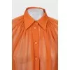 Translucent orange blouse