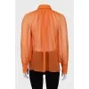 Translucent orange blouse