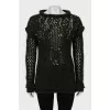 Knitted sweater decorated with rhinestones
