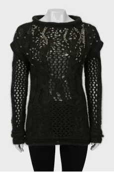 Knitted sweater decorated with rhinestones