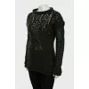 Knitted sweater decorated with rhinestones