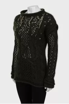 Knitted sweater decorated with rhinestones