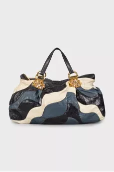Leather bag decorated with rhinestones