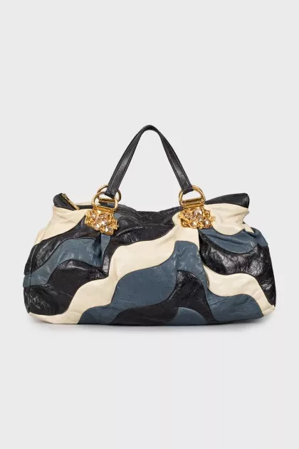 Leather bag decorated with rhinestones
