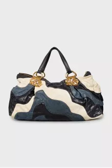 Leather bag decorated with rhinestones