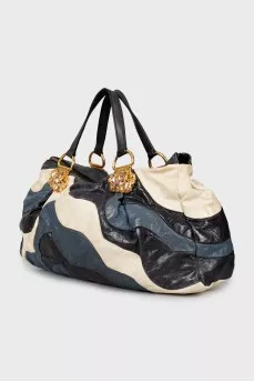 Leather bag decorated with rhinestones