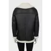 Leather coat with oblique zipper