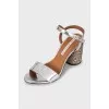 Silver sandals with decorative heels