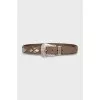 Brown belt with metal decoration