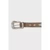 Brown belt with metal decoration