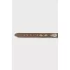 Brown belt with metal decoration