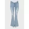 Blue flared jeans with a distressed effect