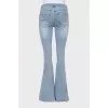 Blue flared jeans with a distressed effect
