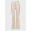 Trousers in houndstooth print with tag