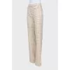 Trousers in houndstooth print with tag