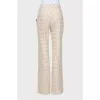 Trousers in houndstooth print with tag