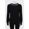 Wool jumper decorated with rhinestones