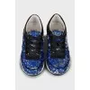 Sneakers embroidered with sequins
