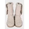 Beige knitted boots