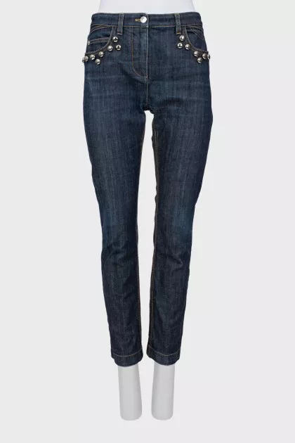 Dark blue jeans with metallic detailing