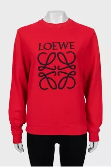 Red sweatshirt with embroidered logo