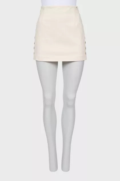Mini skirt decorated with buttons