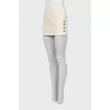 Mini skirt decorated with buttons