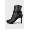 Leather ankle boots with gold hardware
