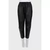 Leather trousers with textile upper