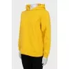 Yellow hoodie with embossed logo