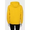 Yellow hoodie with embossed logo