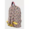 Backpack in a bright print with a tag