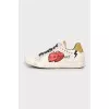 Leather sneakers with print and studs