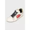 Leather sneakers with print and studs