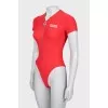 Red bodysuit with zipper and tag
