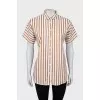 Striped shirt with slits on the sides