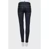 Skinny jeans decorated with chain