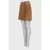 Suede skirt decorated with buttons