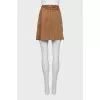 Suede skirt decorated with buttons