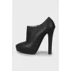 High-heeled leather ankle boots