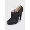 High-heeled leather ankle boots